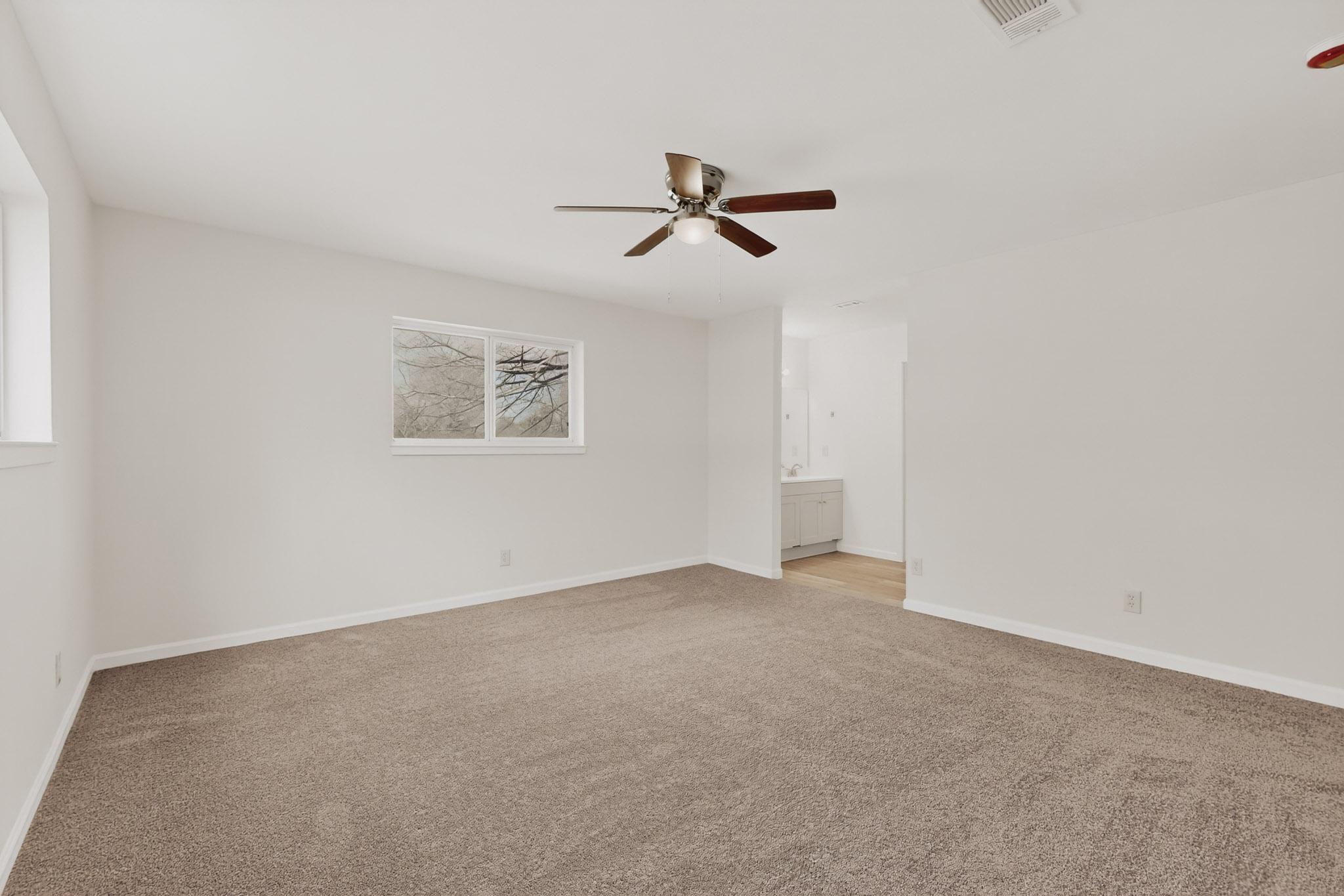 812 George Street Taylor, TX 76574 - Photo 17 of 34 Spare room with light colored carpet and a ceiling fan