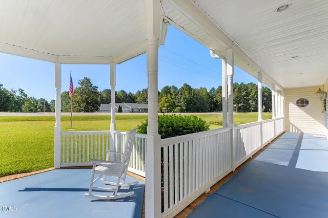 a view of balcony with wooden floor