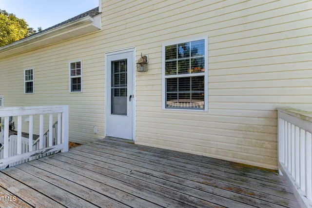 a view of a lake with houses in the back