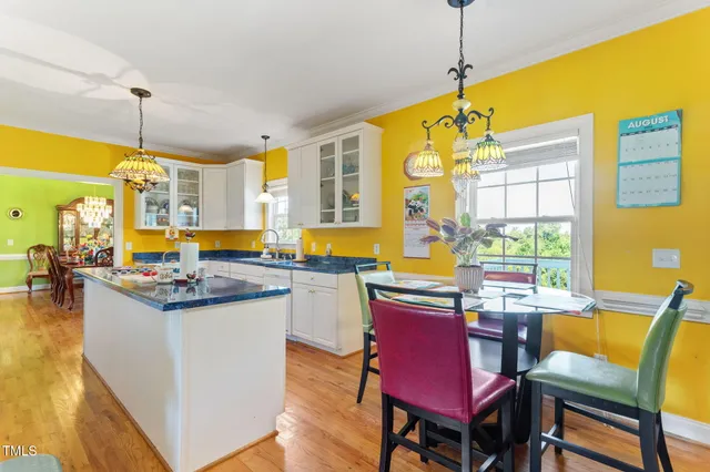 a kitchen with sink and cabinets