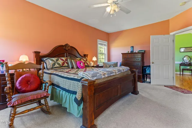 a living room with furniture a air conditioner vent and a window