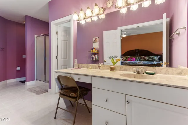 a reading room with furniture and a floor to ceiling window