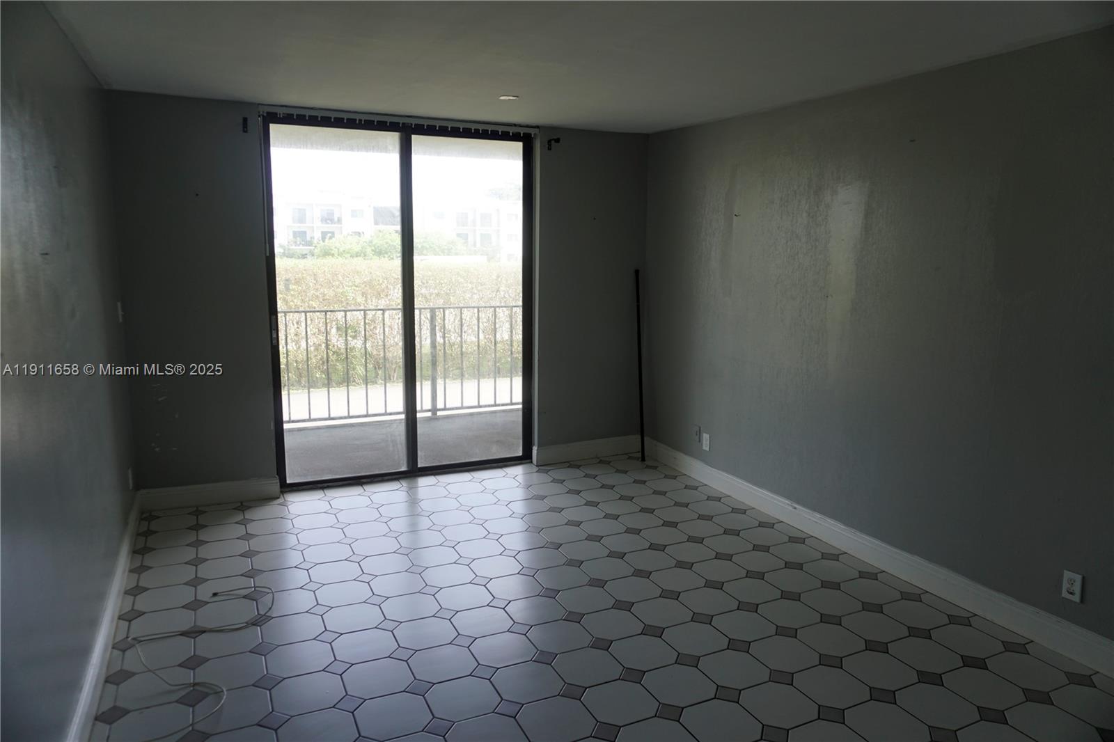 6195 Rock Island Road, Unit 204 Tamarac, FL 33319 - Photo 12 of 23 an empty room with windows