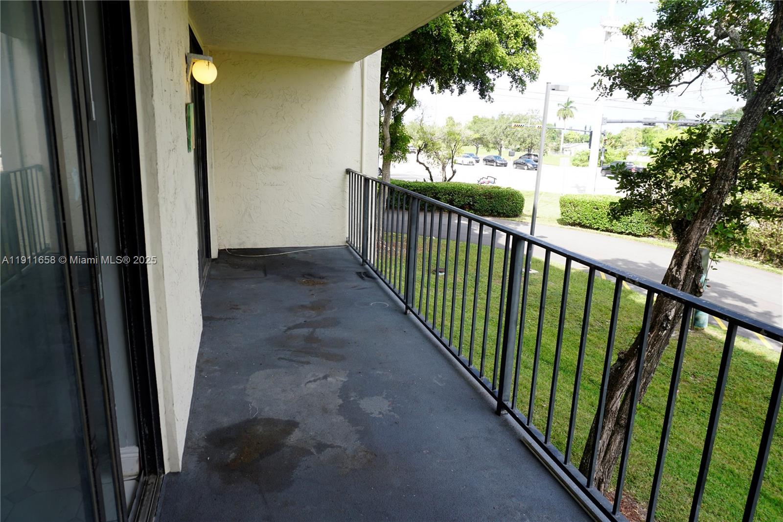 6195 Rock Island Road, Unit 204 Tamarac, FL 33319 - Photo 16 of 23 a view of a balcony