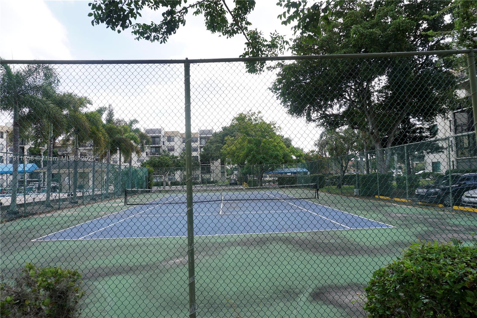 6195 Rock Island Road, Unit 204 Tamarac, FL 33319 - Photo 18 of 23 a view of a tennis court