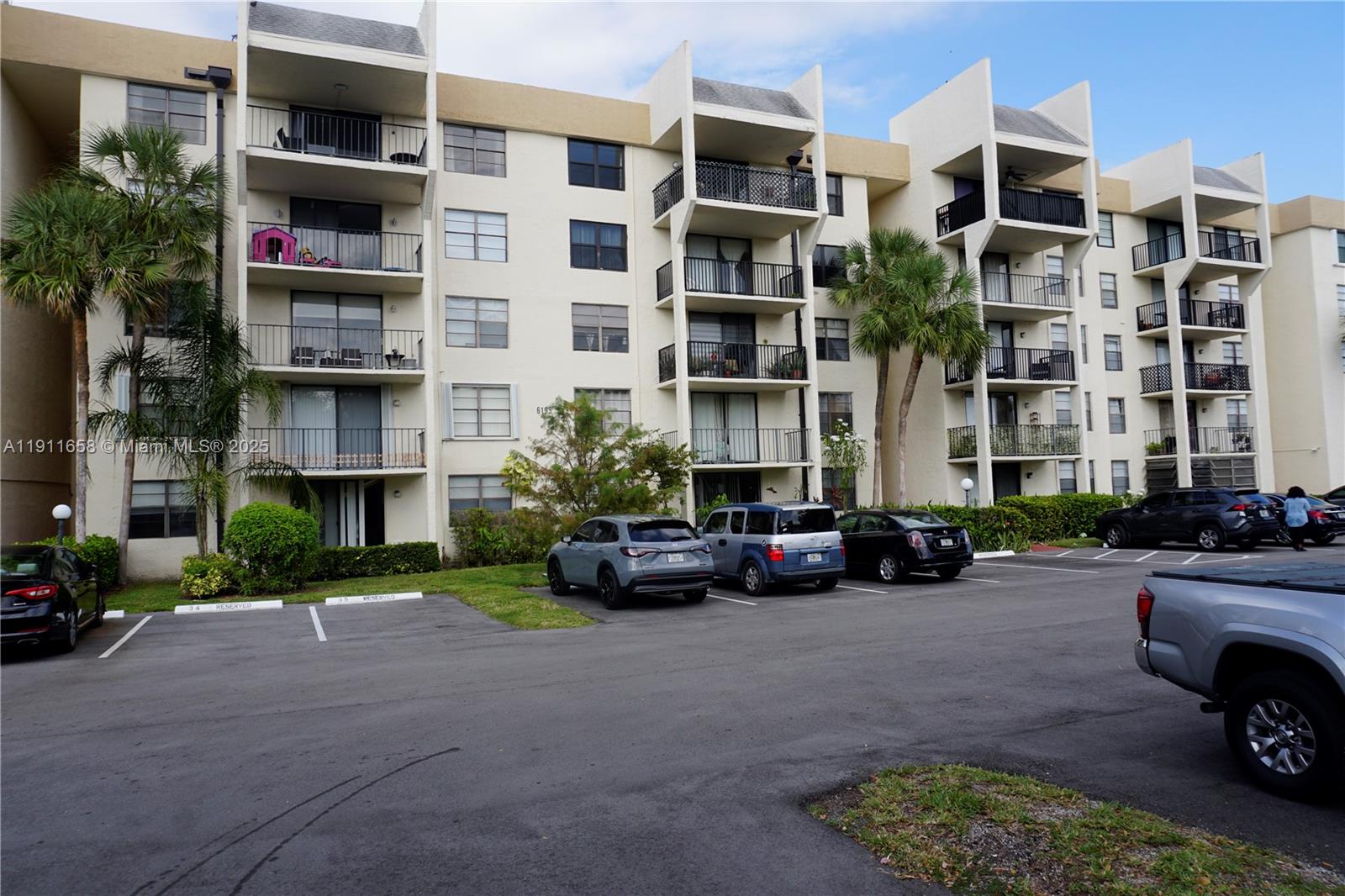 6195 Rock Island Road, Unit 204 Tamarac, FL 33319 - Photo 23 of 23 front view of a building with a street