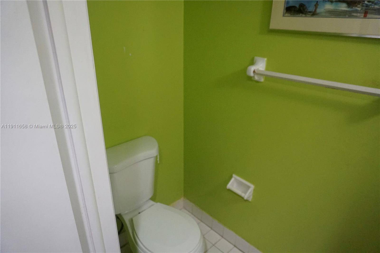 6195 Rock Island Road, Unit 204 Tamarac, FL 33319 - Photo 6 of 23 a bathroom with a toilet and a sink