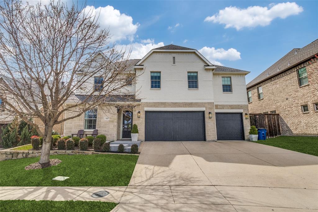 7533 Garonne Street Dallas, TX 75231 - Photo 1 of 32 a view of a white house next to a yard with big trees