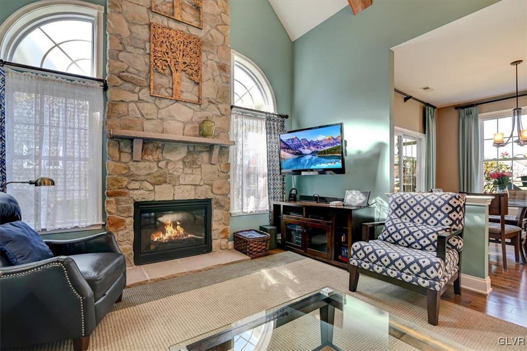 1039 Declaration Drive Bethlehem, PA 18017 - Photo 15 of 50 a living room with furniture a flat screen tv and a fireplace
