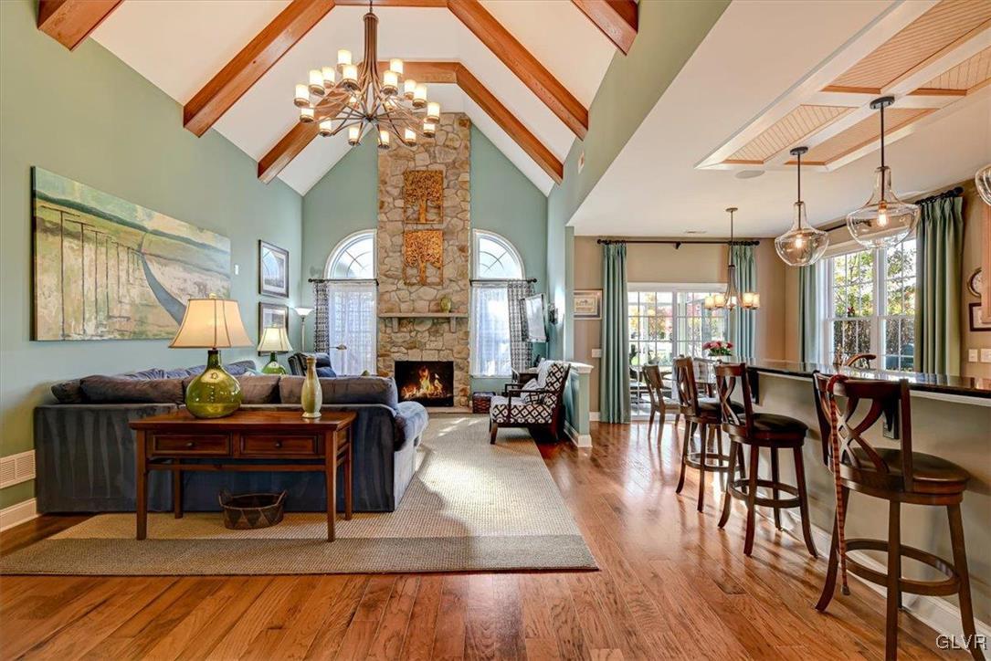 1039 Declaration Drive Bethlehem, PA 18017 - Photo 16 of 50 a living room with furniture a large window and a chandelier