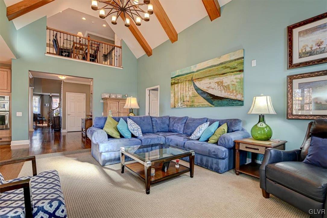 1039 Declaration Drive Bethlehem, PA 18017 - Photo 17 of 50 a living room with furniture and a chandelier
