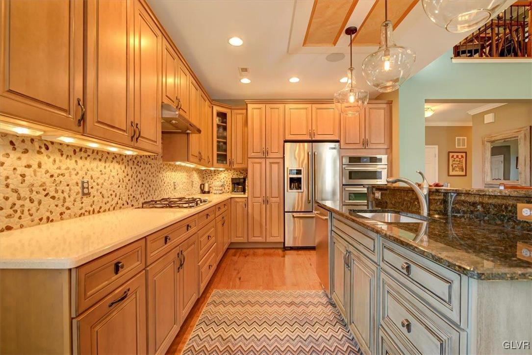 1039 Declaration Drive Bethlehem, PA 18017 - Photo 23 of 50 a kitchen with stainless steel appliances granite countertop a sink a stove and a refrigerator