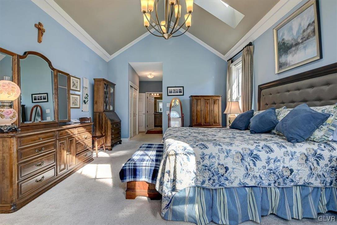 1039 Declaration Drive Bethlehem, PA 18017 - Photo 29 of 50 a bedroom with a bed a dresser and flat screen tv