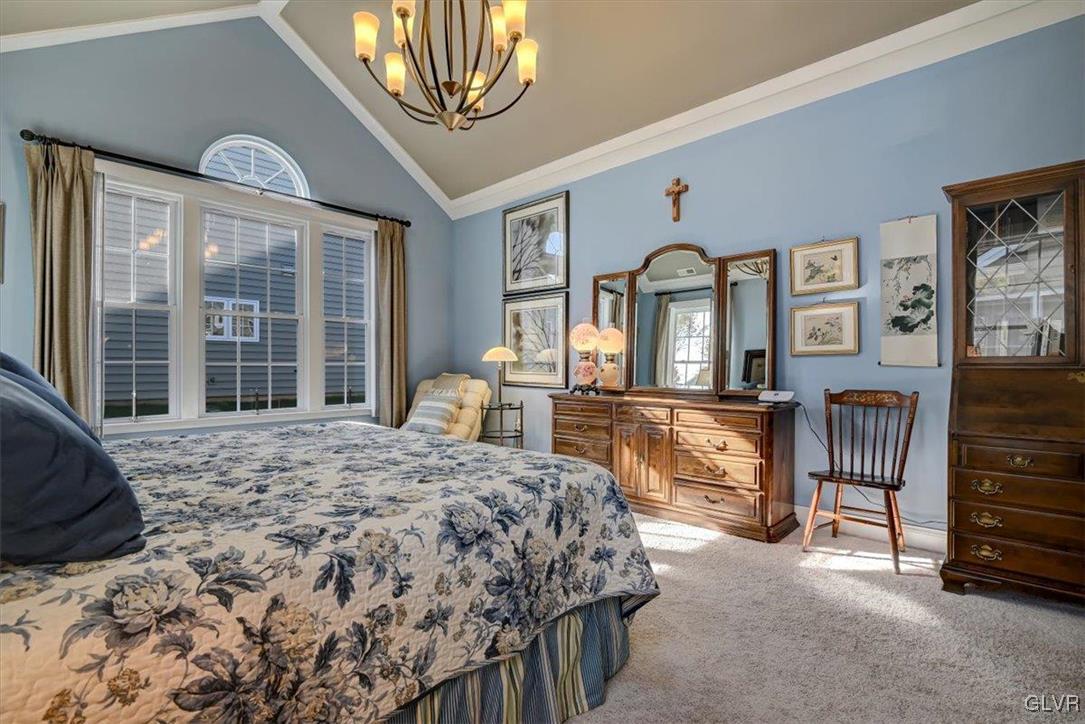 1039 Declaration Drive Bethlehem, PA 18017 - Photo 30 of 50 a bedroom with a bed a dresser and large windows