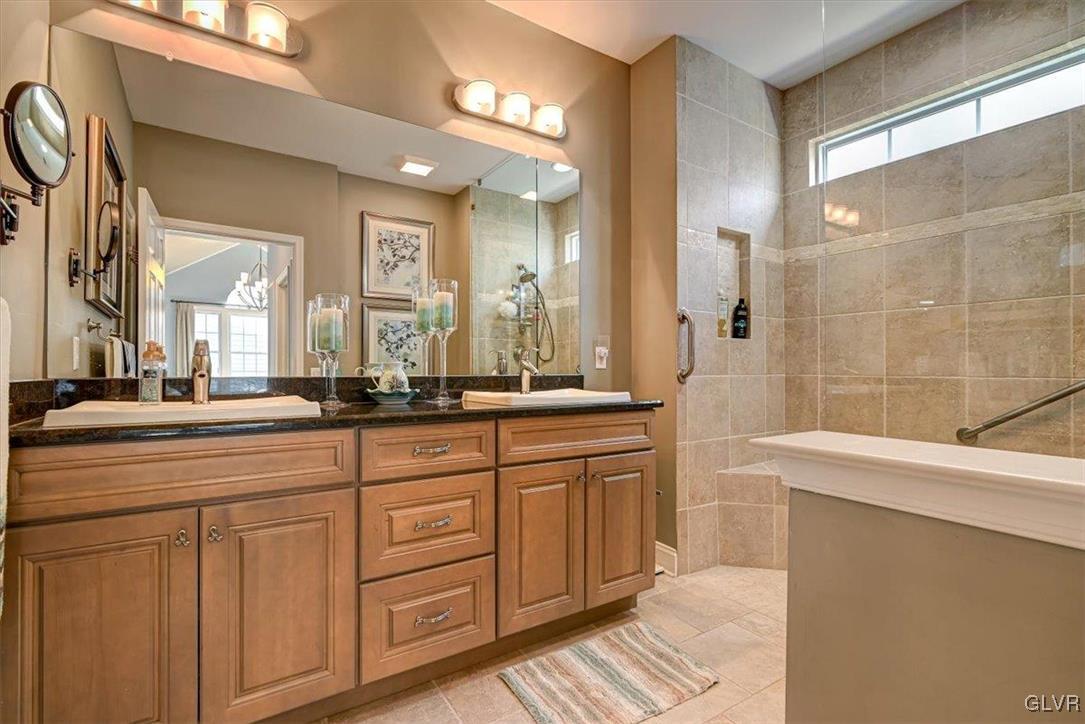 1039 Declaration Drive Bethlehem, PA 18017 - Photo 31 of 50 a spacious bathroom with a double vanity sink a mirror and a shower