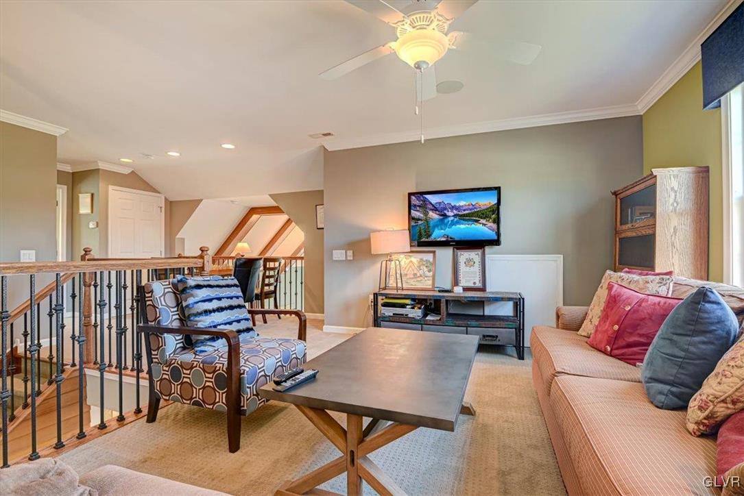 1039 Declaration Drive Bethlehem, PA 18017 - Photo 43 of 50 a living room with furniture a rug and a chandelier