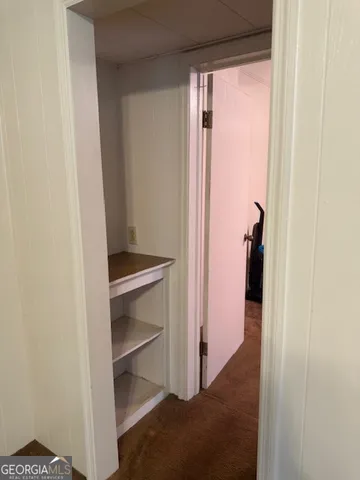 a view of a room with rack on the wall