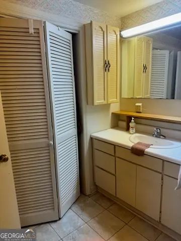 a view of a room with furniture and wooden floor