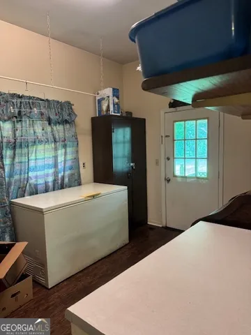 a room with cabinets and wooden floor