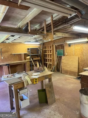 a kitchen with a sink appliances and cabinets