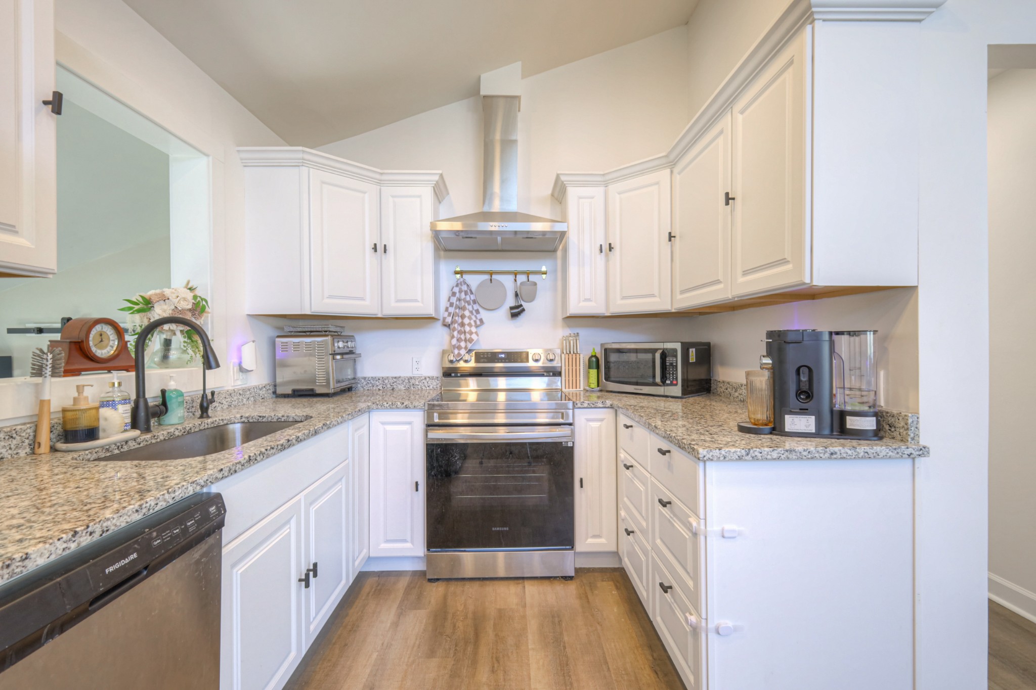 7 Roberts Lane Lebanon, TN 37087 - Photo 11 of 38 a kitchen with stainless steel appliances granite countertop a stove sink and cabinets
