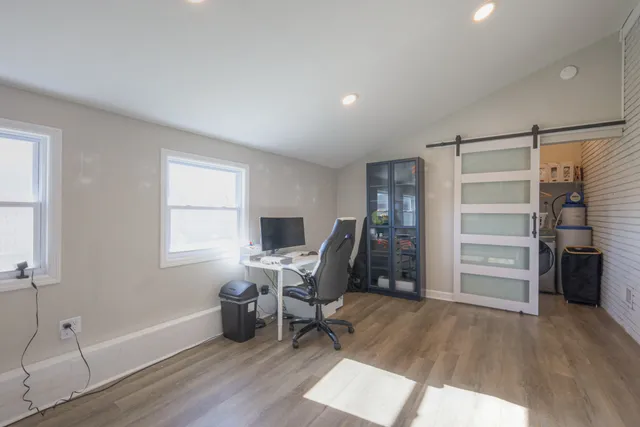 a view of a livingroom with furniture and a window
