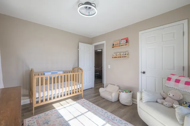 a bedroom with furniture and a window