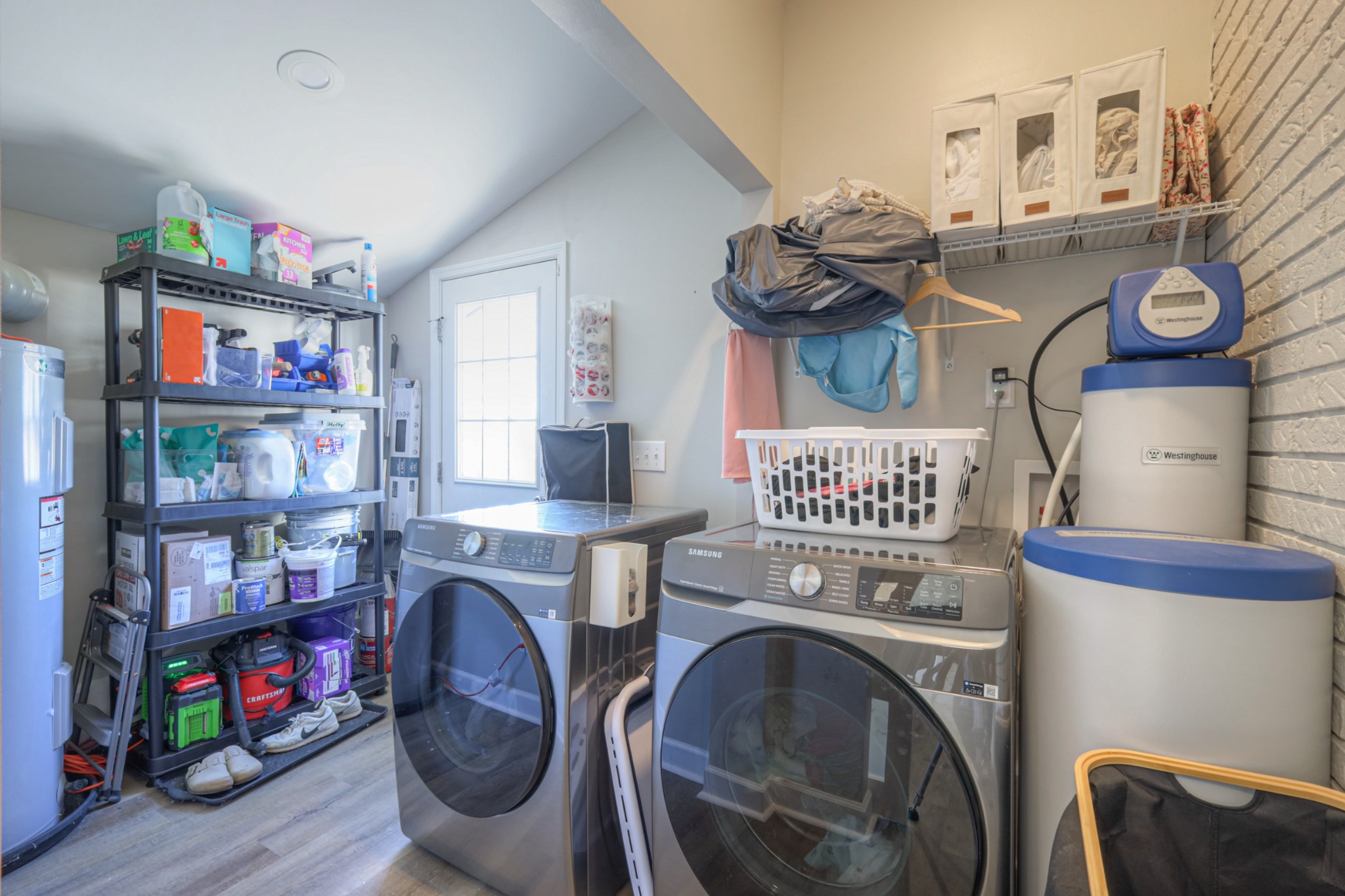 7 Roberts Lane Lebanon, TN 37087 - Photo 24 of 38 a utility room with fridge and wooden floor
