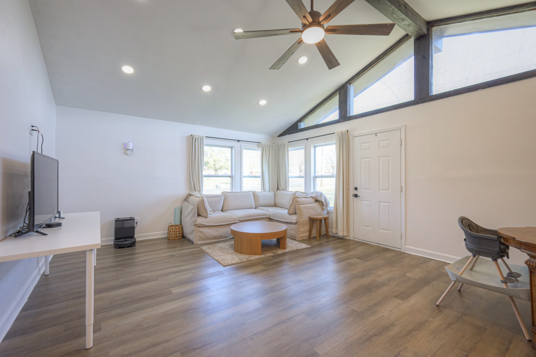 7 Roberts Lane Lebanon, TN 37087 - Photo 3 of 38 a living room with couches and a flat screen tv with kitchen view