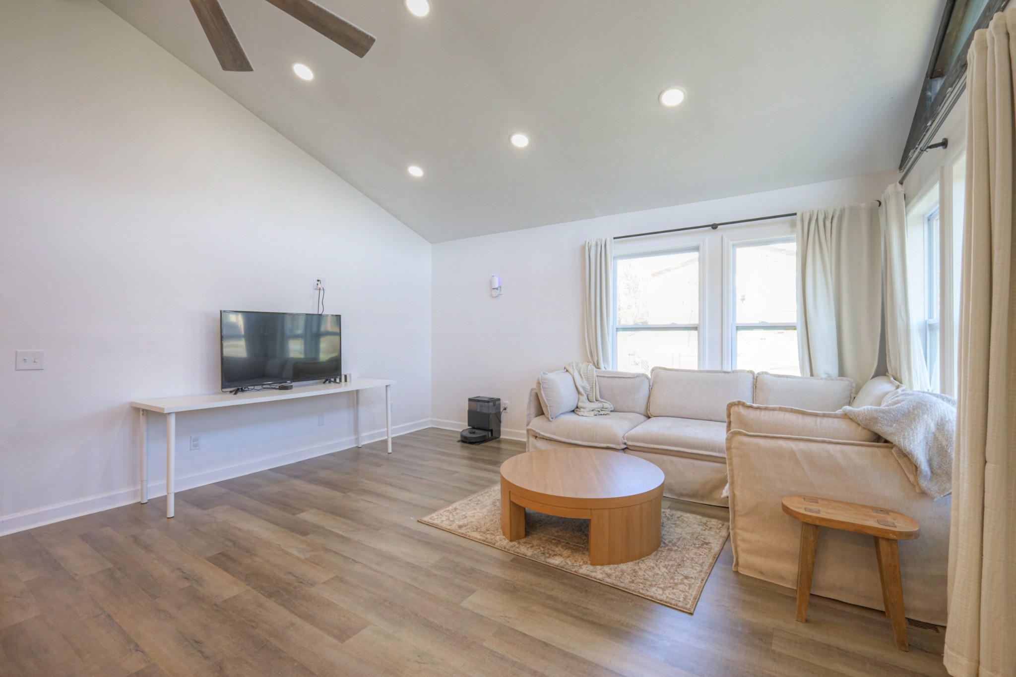 7 Roberts Lane Lebanon, TN 37087 - Photo 4 of 38 a living room with furniture a flat screen tv and a window