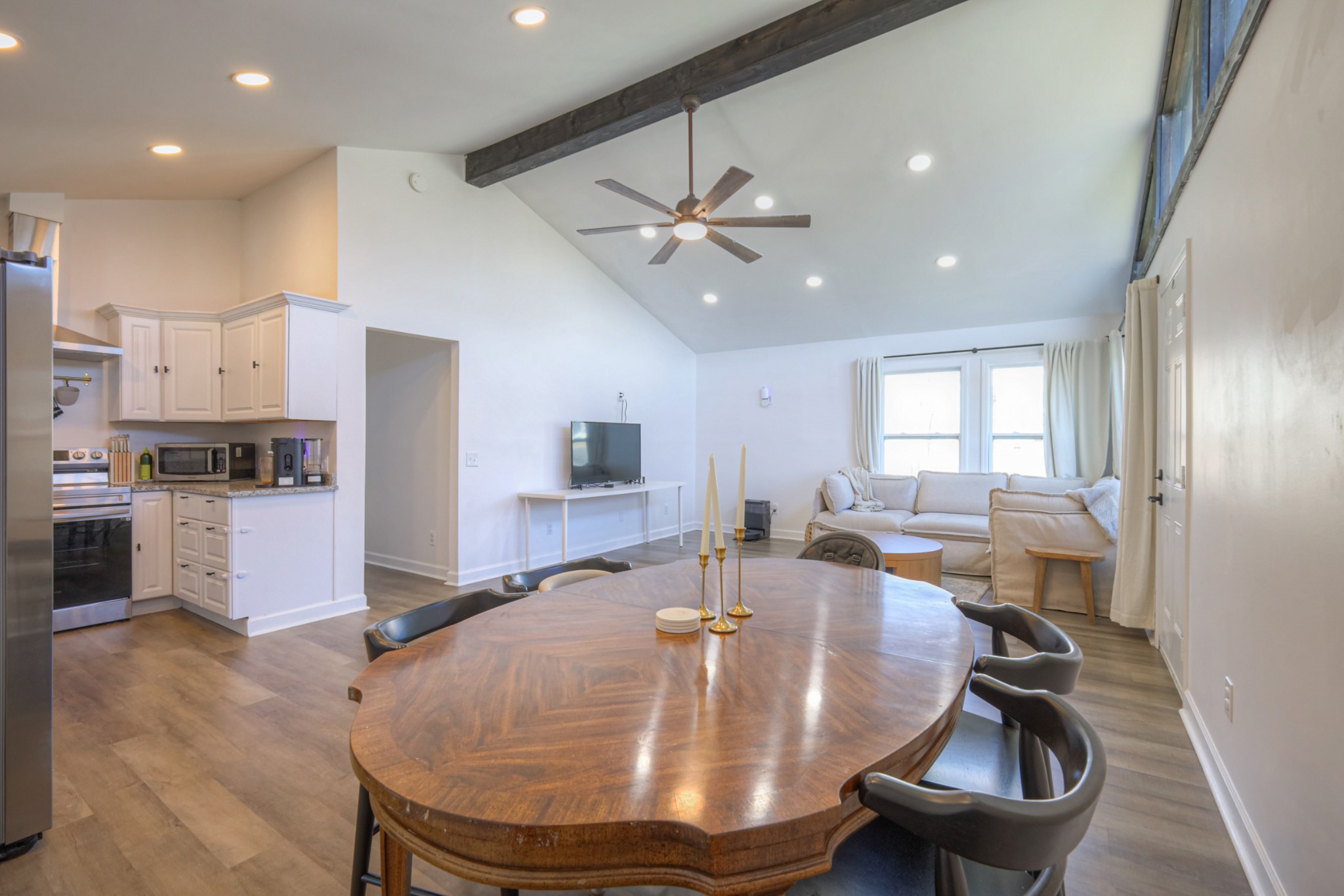 7 Roberts Lane Lebanon, TN 37087 - Photo 7 of 38 a room with stainless steel appliances wooden floor dining table and chairs