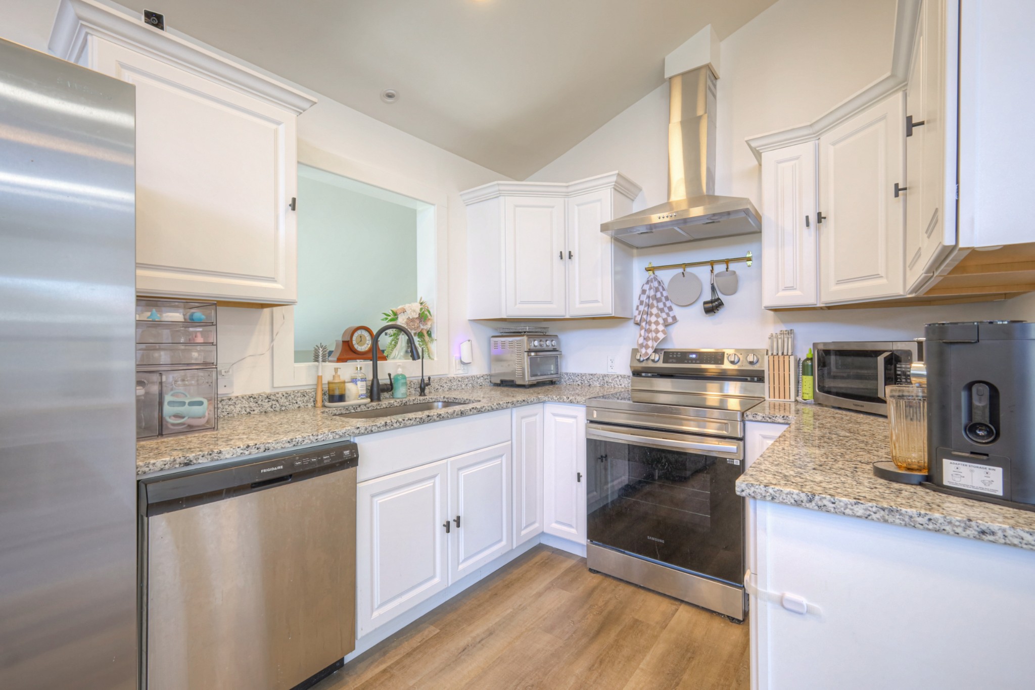 7 Roberts Lane Lebanon, TN 37087 - Photo 10 of 38 a kitchen with granite countertop a sink stainless steel appliances and cabinets