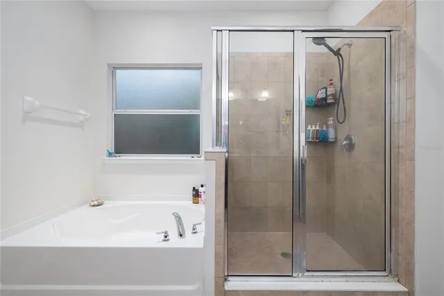 a bathroom with a double vanity sink and mirror