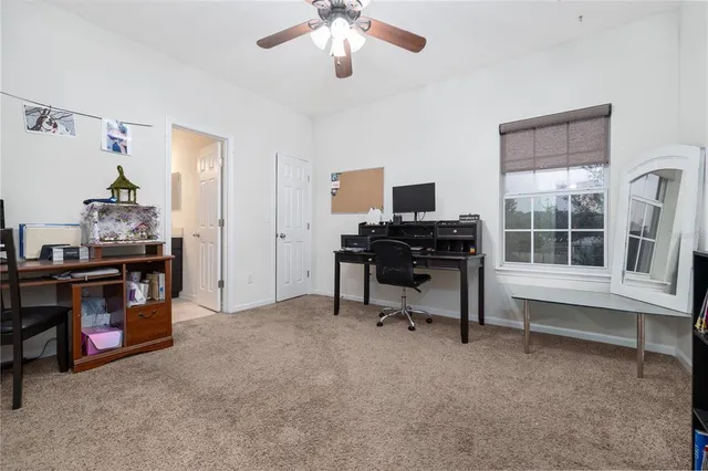 a view of workspace with a window and gym equipment