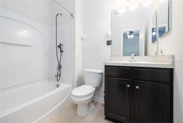 a bathroom with a double vanity sink a mirror and a bathtub