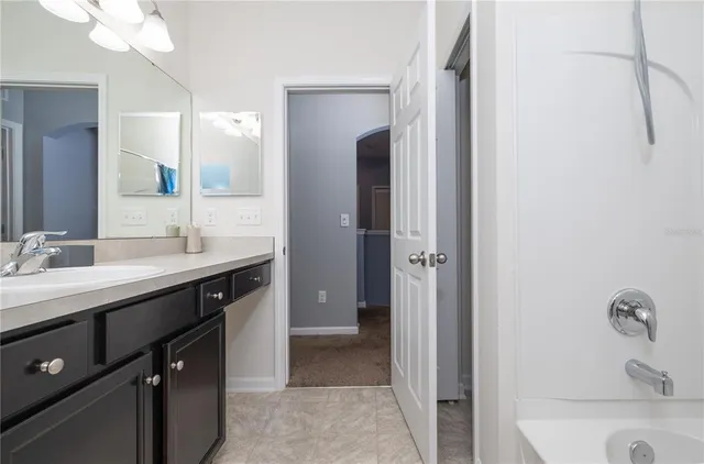 a outdoor space with patio fireplace and a potted plant