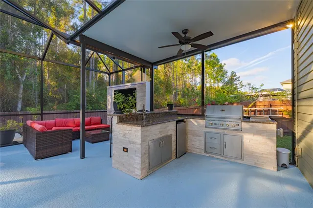 a view of a house with backyard and sitting area