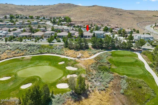 a view of a swimming pool with a yard