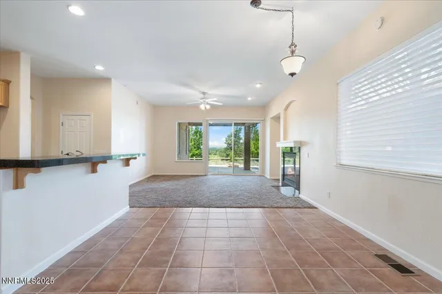 a view of a livingroom with furniture window and wooden floor