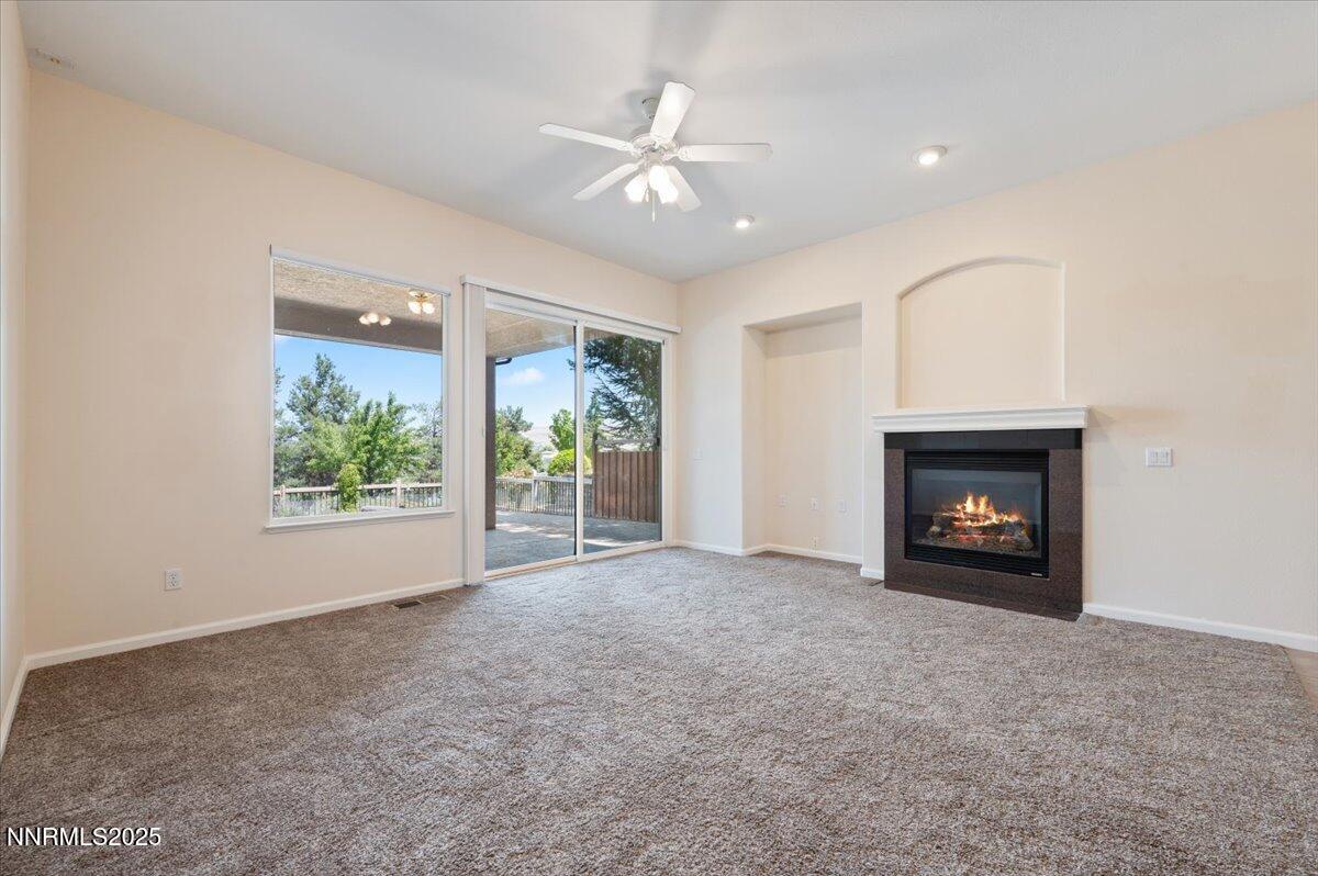2720 Albazano Drive Sparks, NV 89436 - Photo 18 of 47 an empty room with windows and a fireplace