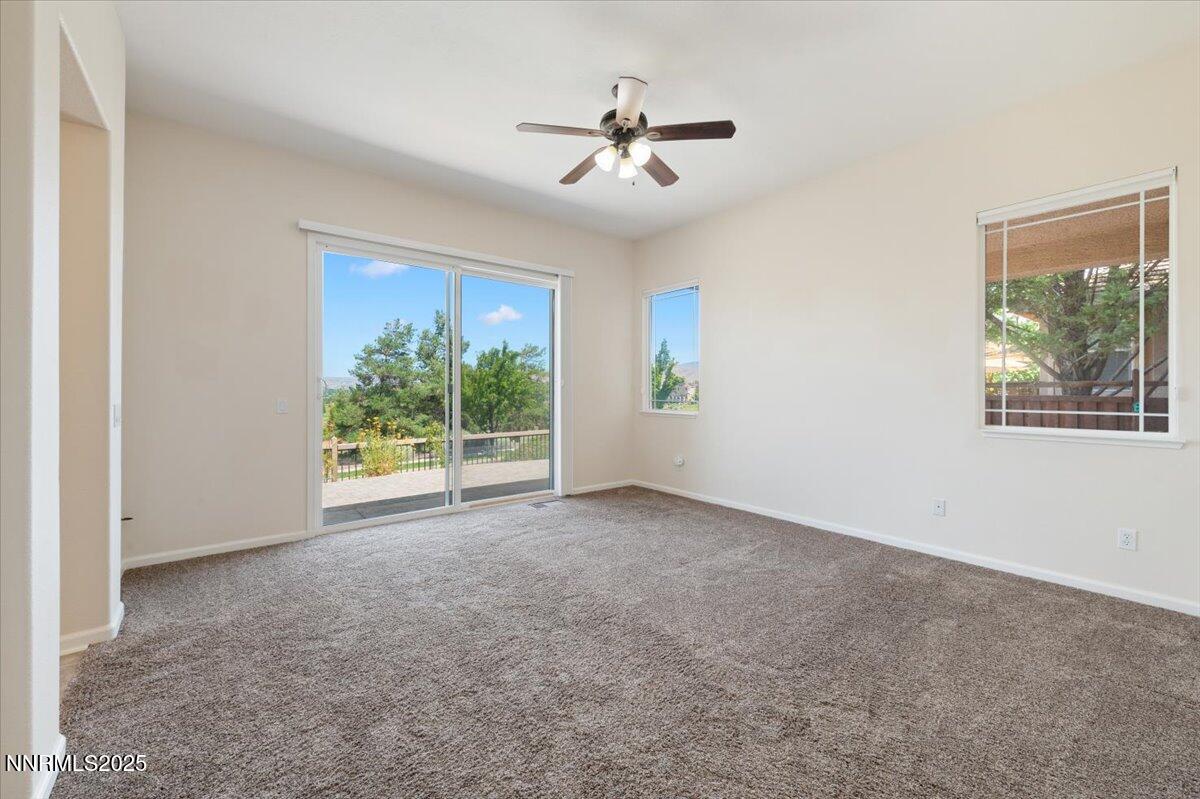 2720 Albazano Drive Sparks, NV 89436 - Photo 21 of 47 a view of a livingroom with a ceiling fan and window