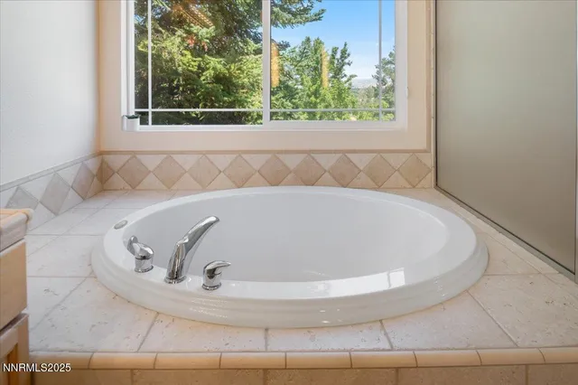 a bathroom with a granite countertop sink mirror and double