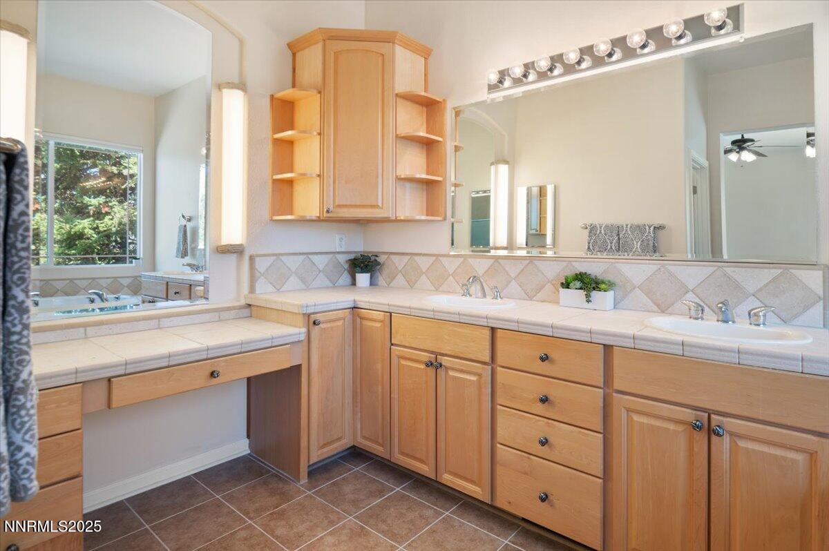 2720 Albazano Drive Sparks, NV 89436 - Photo 29 of 47 a bathroom with a granite countertop sink mirror and double