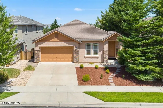 a front view of a house with yard