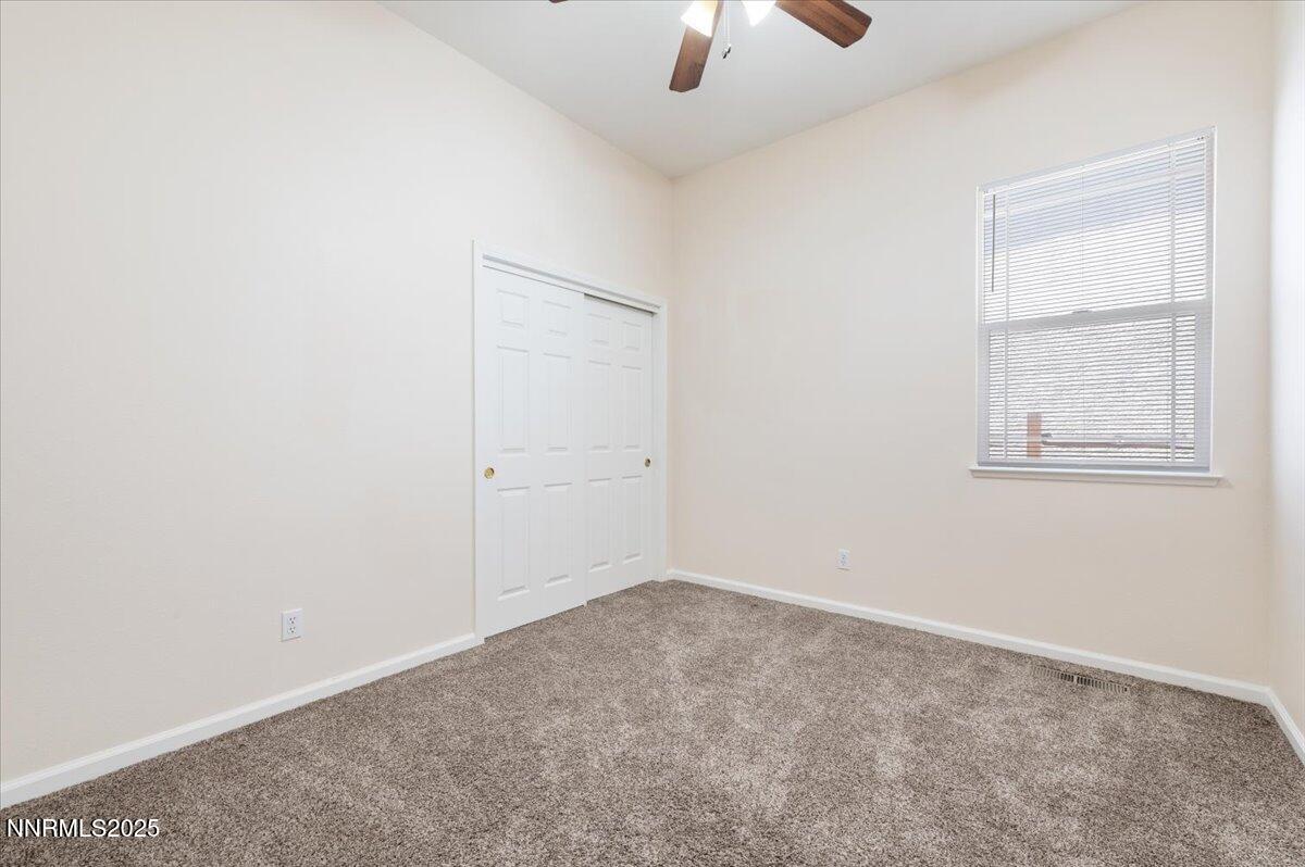 2720 Albazano Drive Sparks, NV 89436 - Photo 31 of 47 an empty room with windows and fan