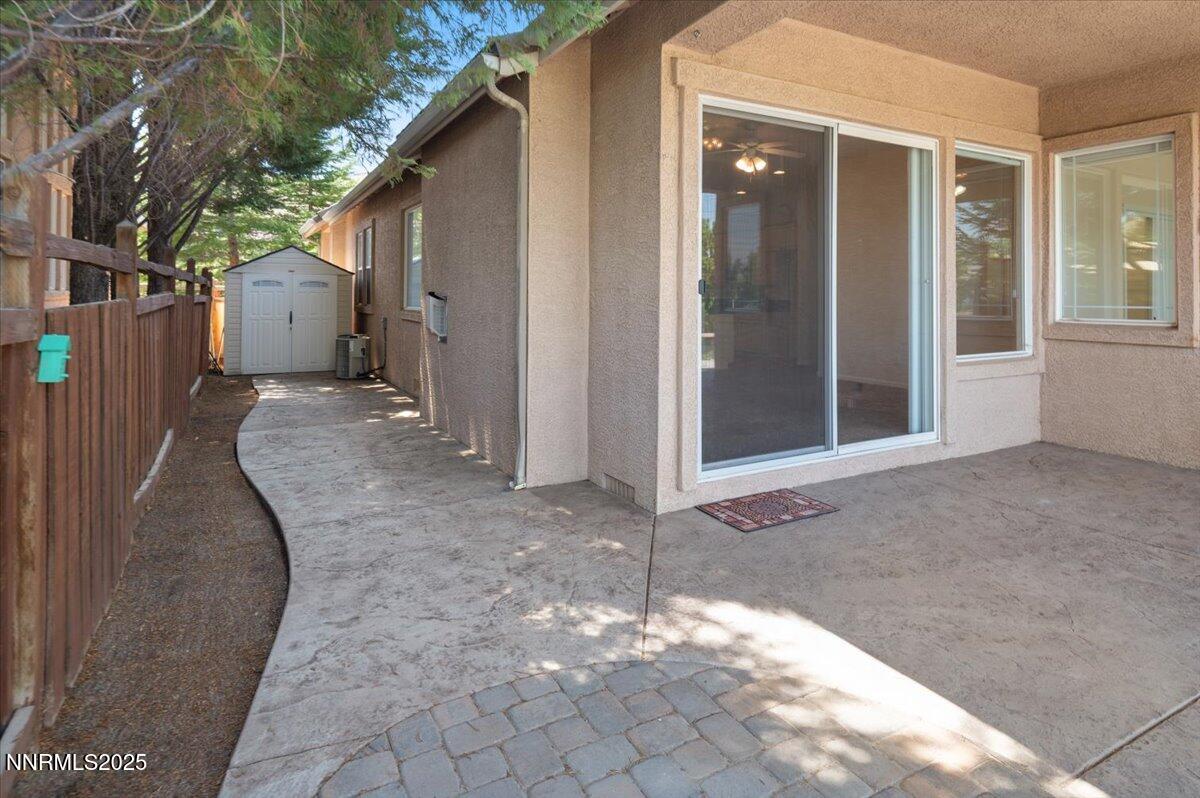 2720 Albazano Drive Sparks, NV 89436 - Photo 36 of 47 a view of a house with a backyard and floor to ceiling windows