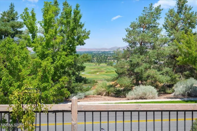 a view of a pathway with a garden