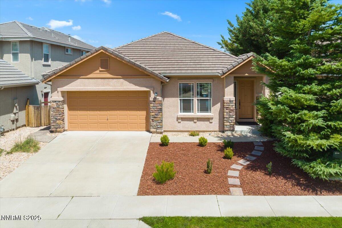 2720 Albazano Drive Sparks, NV 89436 - Photo 4 of 47 a front view of a house with garden