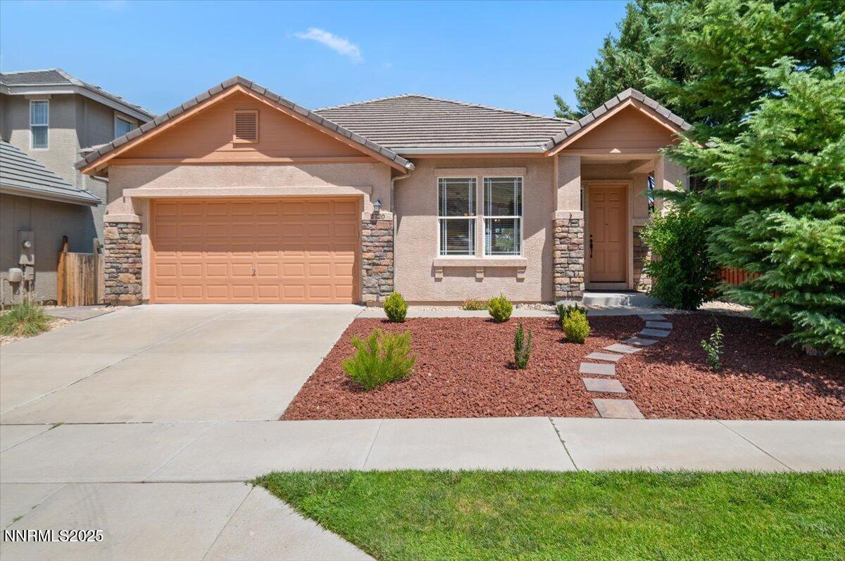 2720 Albazano Drive Sparks, NV 89436 - Photo 5 of 47 a front view of a house with garden