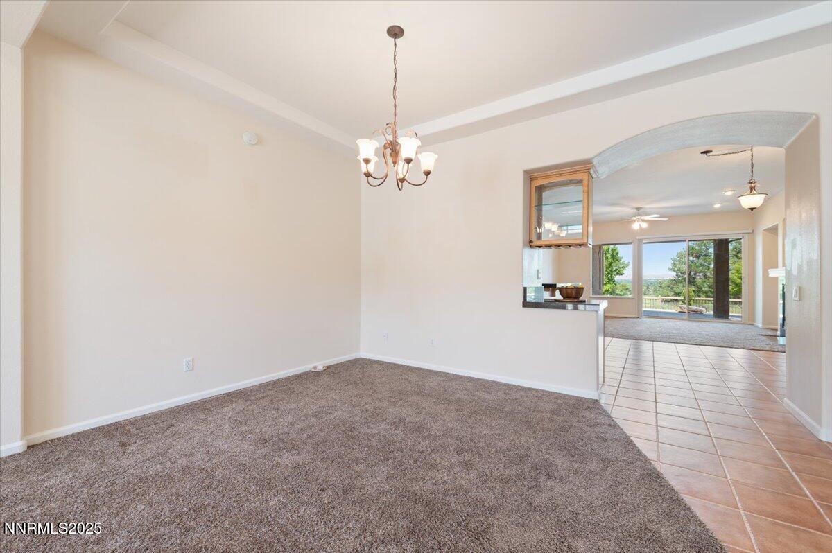 2720 Albazano Drive Sparks, NV 89436 - Photo 10 of 47 a view of a hallway with a chandelier